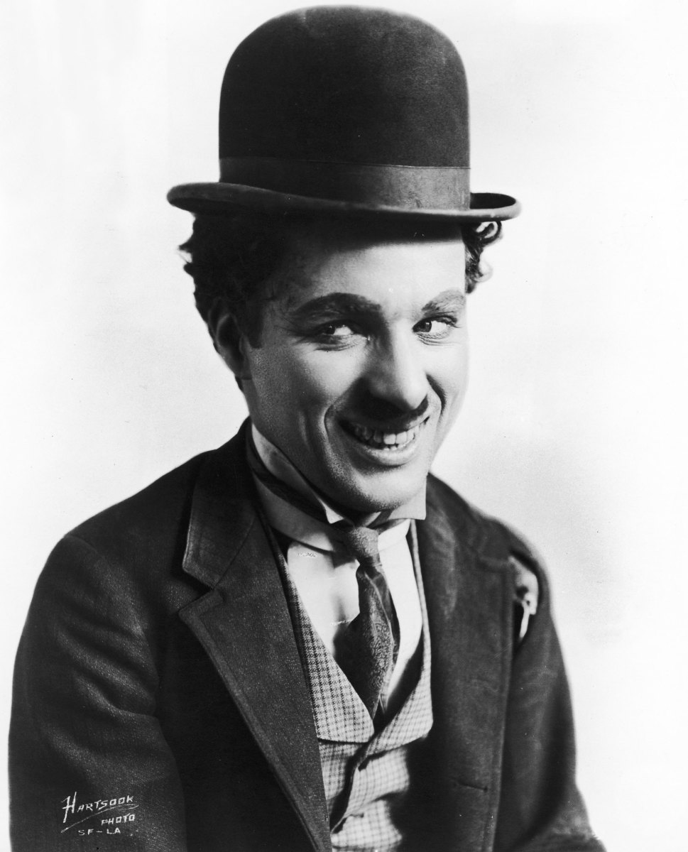 Charlie Chaplin (pictured dressed as the penniless tramp, with bowler hat, moustache and ragged suit) is known for his silent comedies featuring slapstick, pathos and social commentary